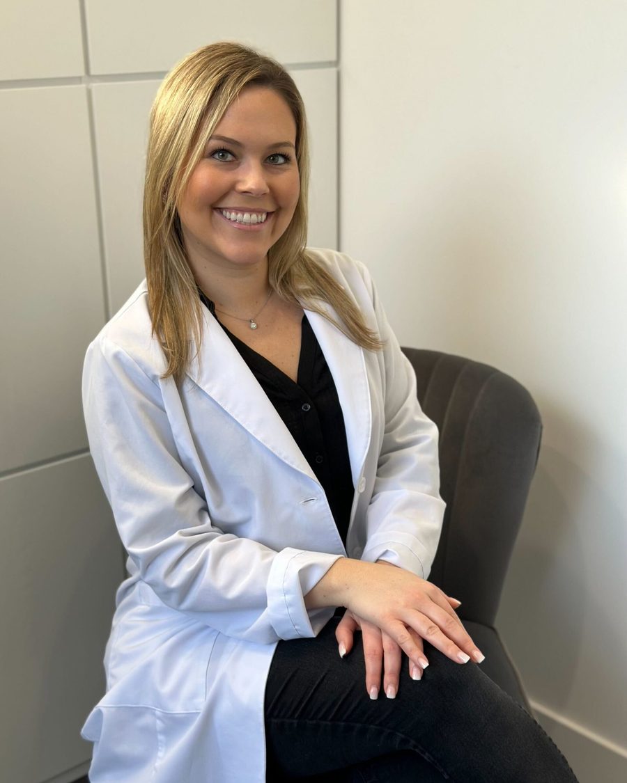 Dr. Jacqueline Younesi, DDS, seated in her Corona Del Mar practice